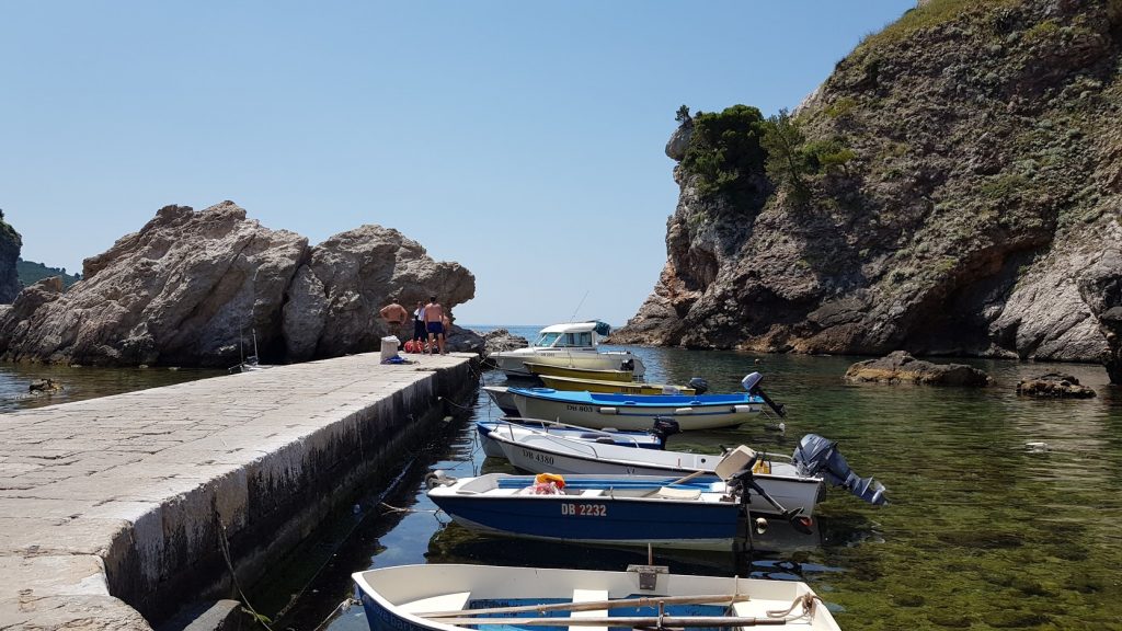 A jetty with a line of row boats